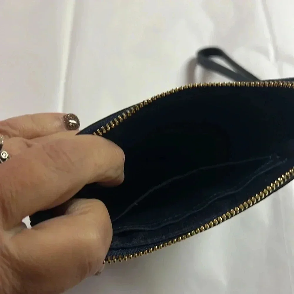 NWT Coach cross grain leather corner zip wristlet.